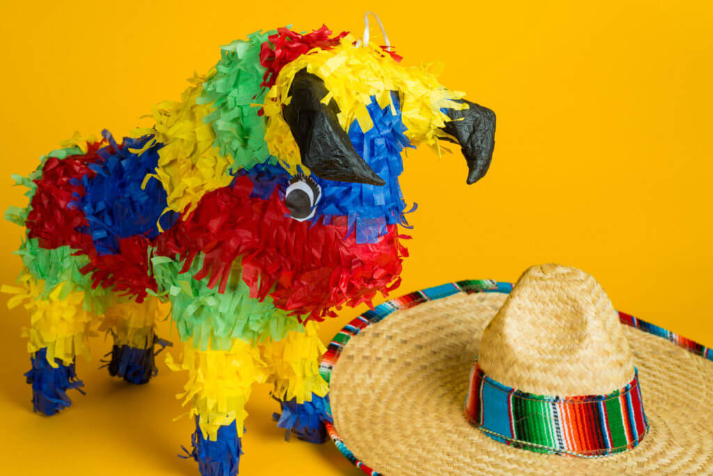 Paper-mache hand-made bull pinata and a mexican sombrero.